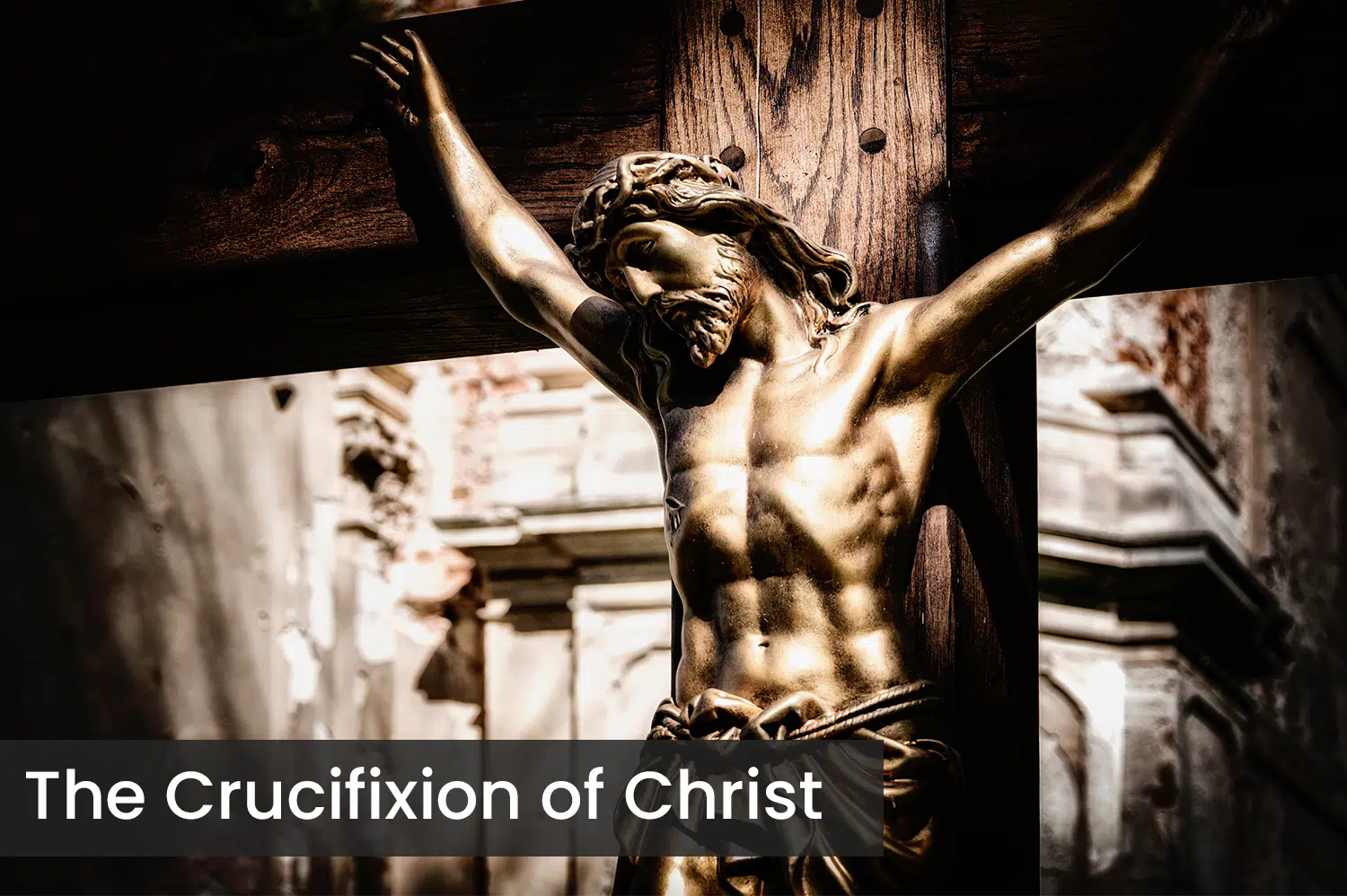 The crucifixion of Christ as a bronze statue, close up to focus on Christ's face.